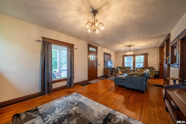 405 Washington St, Pekin, IL 61554 - living area featuring a chandelier, hardwood / wood-style floors, and baseboards