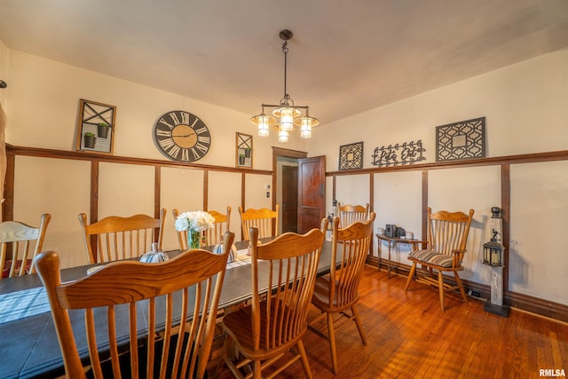 405 Washington St, Pekin, IL 61554 - dining room with wood finished floors and a chandelier