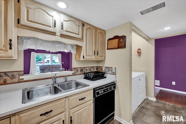 kitchen with black dishwasher, washer and dryer, a sink, light brown cabinets, and recessed lighting