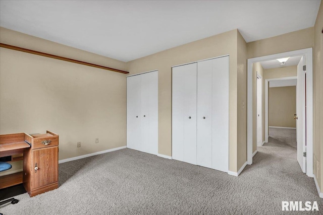 unfurnished office featuring carpet flooring and baseboards