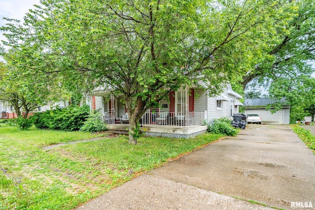 128 W Spruce St, Canton, IL 61520 - obstructed view of property with a porch and concrete driveway