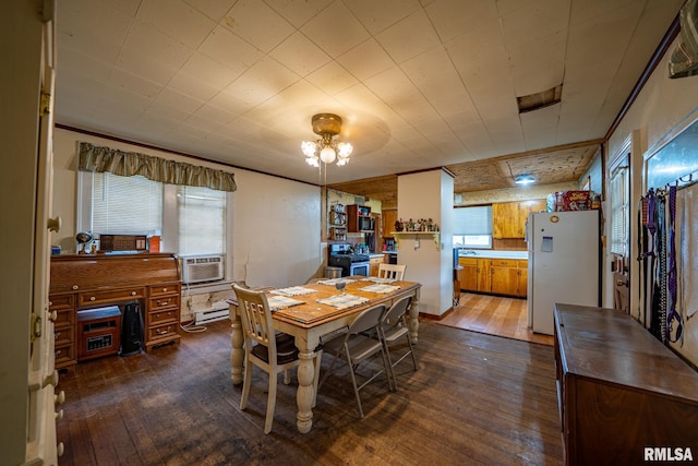 128 W Spruce St, Canton, IL 61520 - dining area featuring dark wood-style floors, a baseboard radiator, cooling unit, and a chandelier