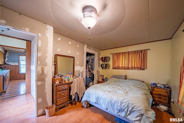 128 W Spruce St, Canton, IL 61520 - bedroom with light wood finished floors, a closet, ceiling fan, and a sink