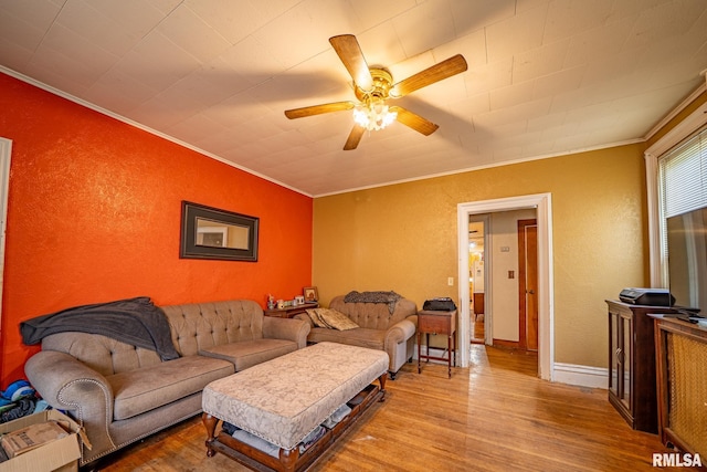 128 W Spruce St, Canton, IL 61520 - living room featuring ornamental molding, wood finished floors, ceiling fan, a textured wall, and baseboards