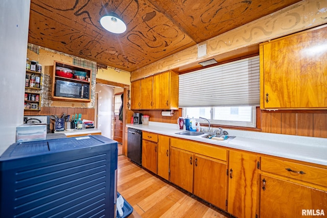 128 W Spruce St, Canton, IL 61520 - kitchen with black appliances, a sink, light wood-type flooring, light countertops, and brown cabinets
