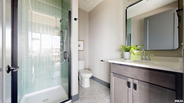 1001 SW Adams St Unit 304, Peoria, IL 61602 - full bath with toilet, a stall shower, vanity, baseboards, and tile patterned flooring