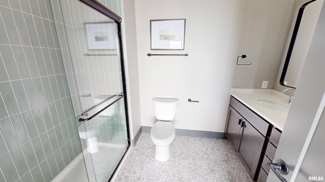 1001 SW Adams St Unit 304, Peoria, IL 61602 - full bathroom featuring vanity, toilet, a tile shower, baseboards, and tile patterned floors