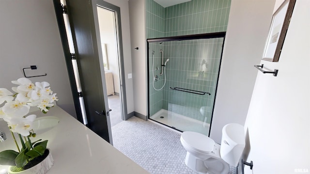 1001 SW Adams St Unit 304, Peoria, IL 61602 - full bathroom featuring a shower stall, toilet, and vanity