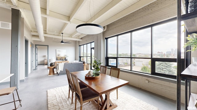 1001 SW Adams St Unit 304, Peoria, IL 61602 - sunroom / solarium featuring beam ceiling