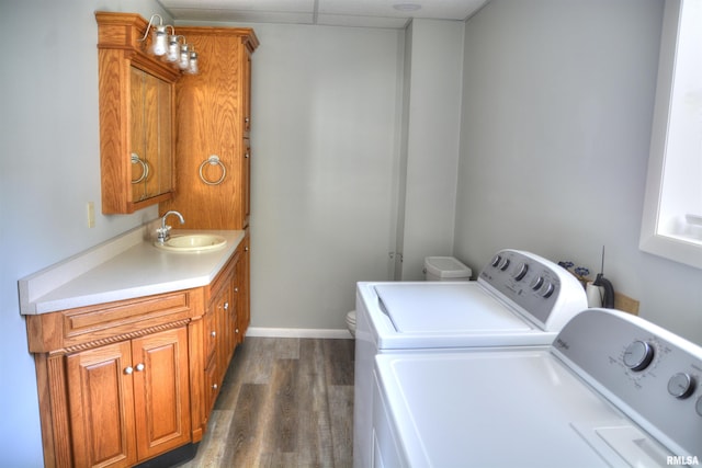 309 S Dudley St, Macomb, IL 61455 - laundry room with washing machine and dryer and dark wood-type flooring