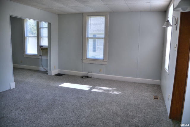 309 S Dudley St, Macomb, IL 61455 - unfurnished room with carpet flooring, a paneled ceiling, and baseboards