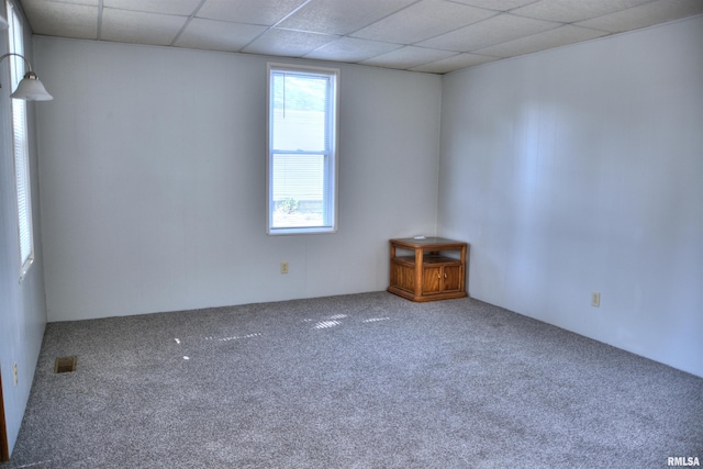309 S Dudley St, Macomb, IL 61455 - unfurnished room featuring carpet floors and a drop ceiling