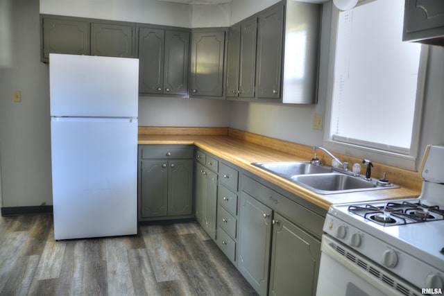 309 S Dudley St, Macomb, IL 61455 - kitchen with white appliances, a sink, dark wood-style floors, and gray cabinets