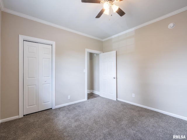 2205 N N St, Peoria, IL 61604 - unfurnished bedroom with crown molding, carpet flooring, baseboards, a ceiling fan, and a closet