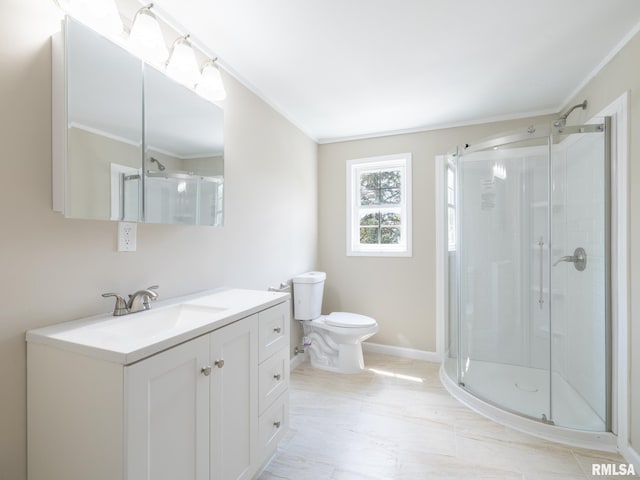 2205 N N St, Peoria, IL 61604 - bathroom featuring crown molding, a shower stall, toilet, and vanity