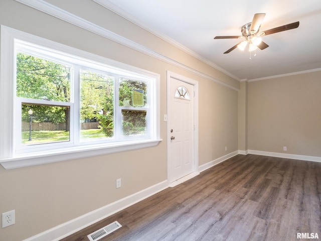 2205 N N St, Peoria, IL 61604 - foyer featuring plenty of natural light, wood finished floors, crown molding, and baseboards
