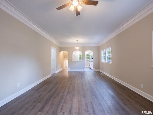 2205 N N St, Peoria, IL 61604 - spare room featuring arched walkways, ceiling fan, dark wood finished floors, ornamental molding, and baseboards