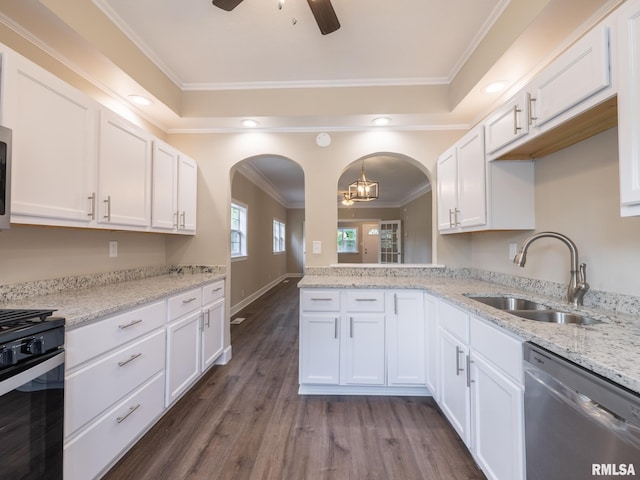 2205 N N St, Peoria, IL 61604 - kitchen featuring dishwasher, stove, ceiling fan, arched walkways, and crown molding