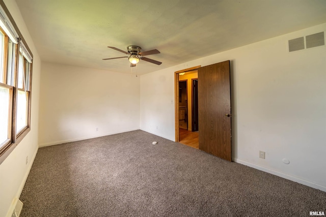 2706 W Millbrook Ct, Peoria, IL 61615 - spare room with carpet, ceiling fan, and baseboards