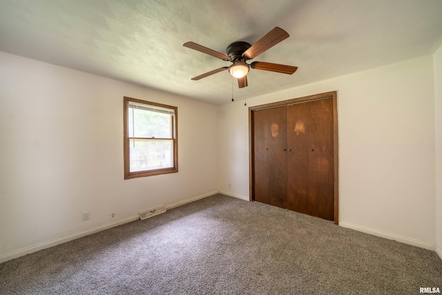 2706 W Millbrook Ct, Peoria, IL 61615 - unfurnished bedroom featuring carpet floors, a closet, and baseboards