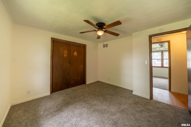 2706 W Millbrook Ct, Peoria, IL 61615 - unfurnished bedroom with carpet flooring, a closet, baseboards, and ceiling fan