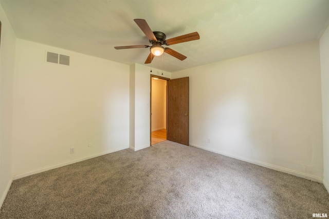 2706 W Millbrook Ct, Peoria, IL 61615 - spare room featuring carpet, ceiling fan, and baseboards