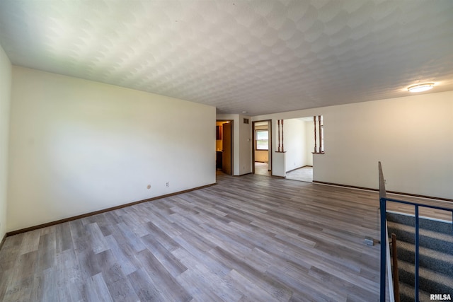 2706 W Millbrook Ct, Peoria, IL 61615 - spare room featuring wood finished floors and baseboards
