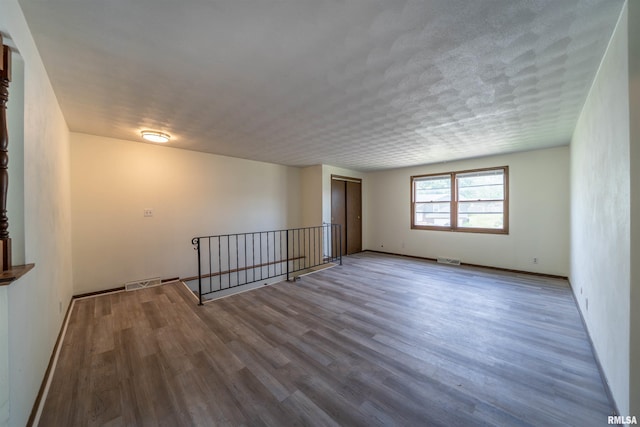 2706 W Millbrook Ct, Peoria, IL 61615 - empty room featuring wood finished floors and baseboards