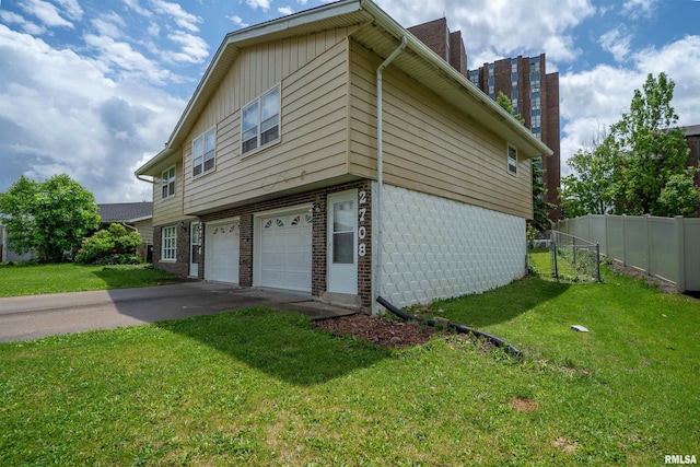 2706 W Millbrook Ct, Peoria, IL 61615 - view of side of home featuring an attached garage, asphalt driveway, and a chimney