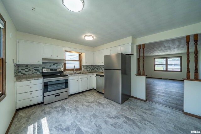 2706 W Millbrook Ct, Peoria, IL 61615 - kitchen with stainless steel appliances, healthy amount of natural light, a sink, and white cabinetry