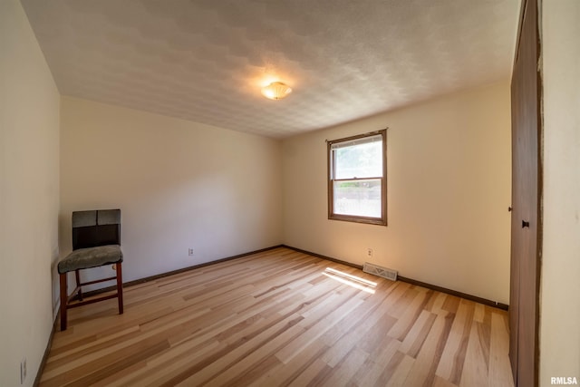 2706 W Millbrook Ct, Peoria, IL 61615 - empty room with light wood-type flooring and baseboards