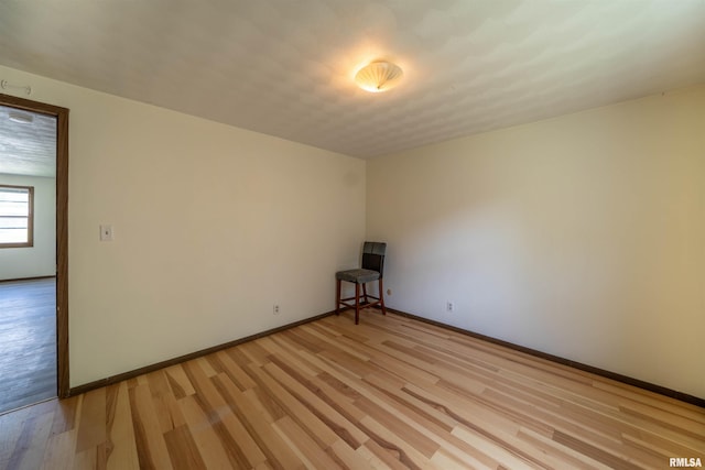 2706 W Millbrook Ct, Peoria, IL 61615 - empty room featuring light wood finished floors and baseboards