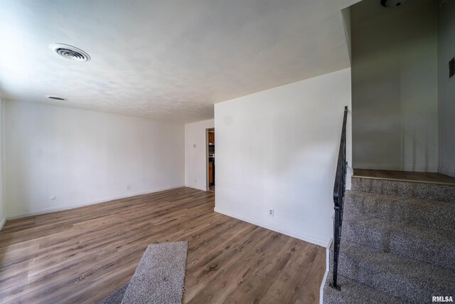 2706 W Millbrook Ct, Peoria, IL 61615 - spare room featuring wood finished floors and baseboards
