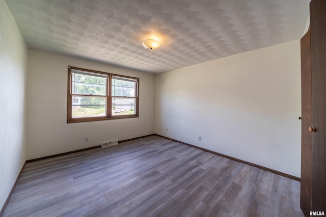 2706 W Millbrook Ct, Peoria, IL 61615 - empty room with wood finished floors and baseboards