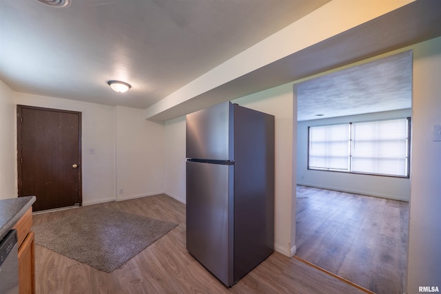 2706 W Millbrook Ct, Peoria, IL 61615 - kitchen with appliances with stainless steel finishes, wood finished floors, and baseboards