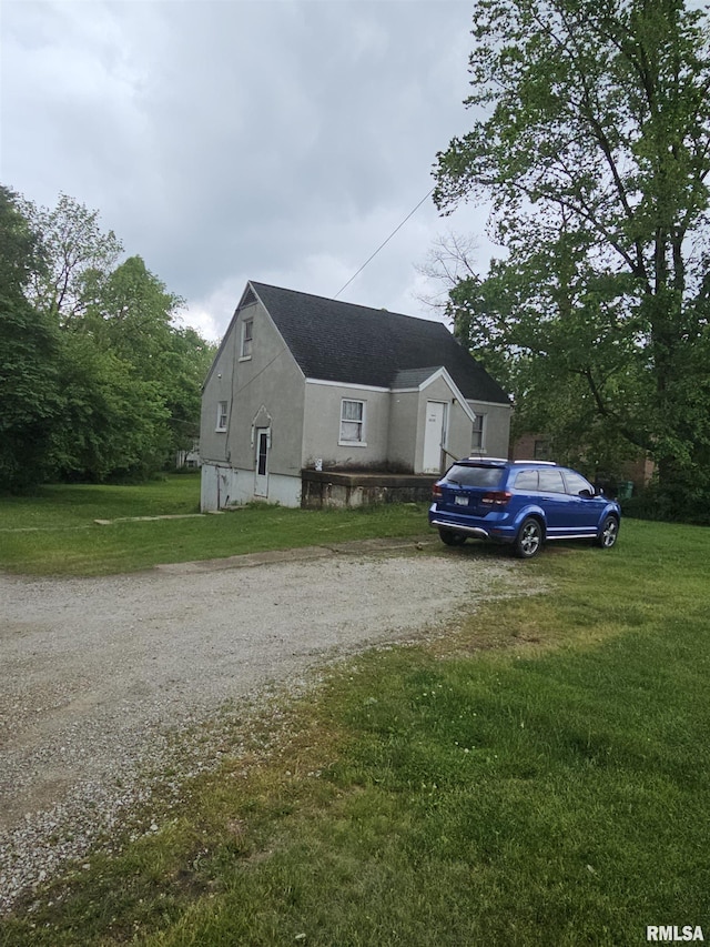 3304 E Washington St, East Peoria, IL 61611 - view of home's exterior with driveway and a lawn