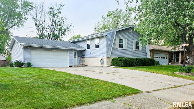 7409 N Piccadilly Pl, Peoria, IL 61614 - split level home with concrete driveway, a front lawn, and an attached garage