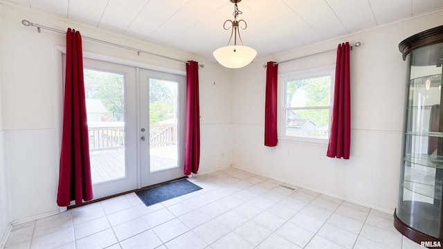 7409 N Piccadilly Pl, Peoria, IL 61614 - entryway with french doors and a wainscoted wall