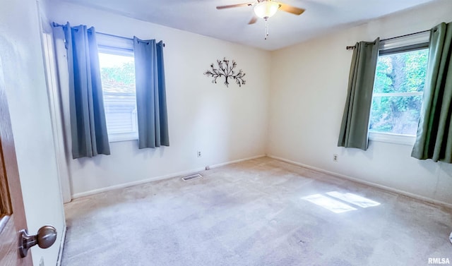7409 N Piccadilly Pl, Peoria, IL 61614 - carpeted spare room with a ceiling fan and healthy amount of natural light