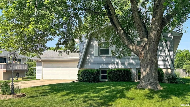 7409 N Piccadilly Pl, Peoria, IL 61614 - view of front of house featuring concrete driveway, a garage, and a front lawn