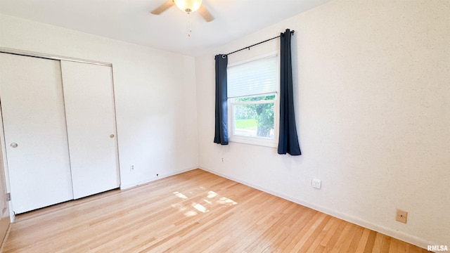 7409 N Piccadilly Pl, Peoria, IL 61614 - unfurnished bedroom featuring wood finished floors, a closet, and ceiling fan