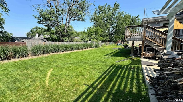 7409 N Piccadilly Pl, Peoria, IL 61614 - view of yard featuring stairs and a deck