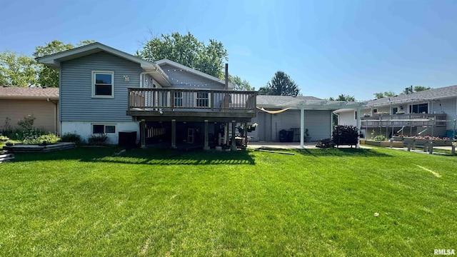7409 N Piccadilly Pl, Peoria, IL 61614 - rear view of house featuring a wooden deck, a lawn, a garden, and a patio