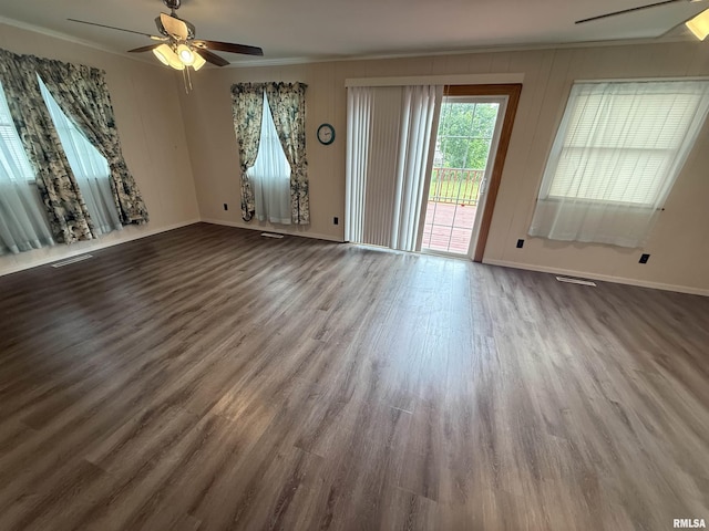 130 E Maple St, Roseville, IL 61473 - unfurnished living room with a ceiling fan, baseboards, wood finished floors, and crown molding