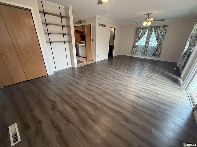 130 E Maple St, Roseville, IL 61473 - unfurnished bedroom with crown molding, dark wood finished floors, and multiple windows