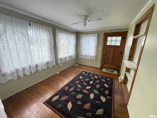130 E Maple St, Roseville, IL 61473 - entrance foyer with wood finished floors, ceiling fan, and crown molding