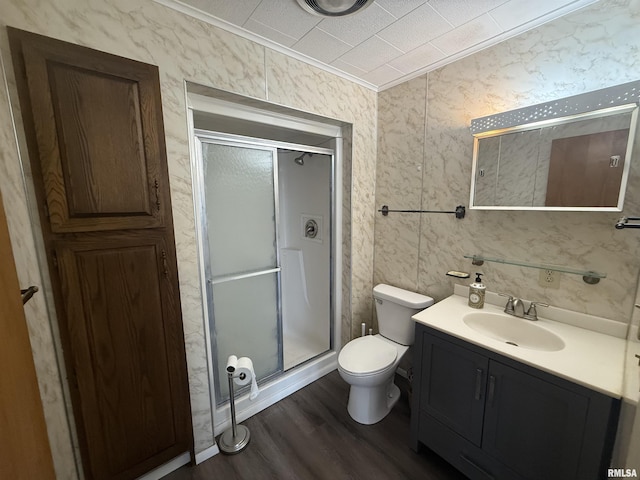 130 E Maple St, Roseville, IL 61473 - bathroom featuring vanity, a shower stall, wood finished floors, toilet, and crown molding