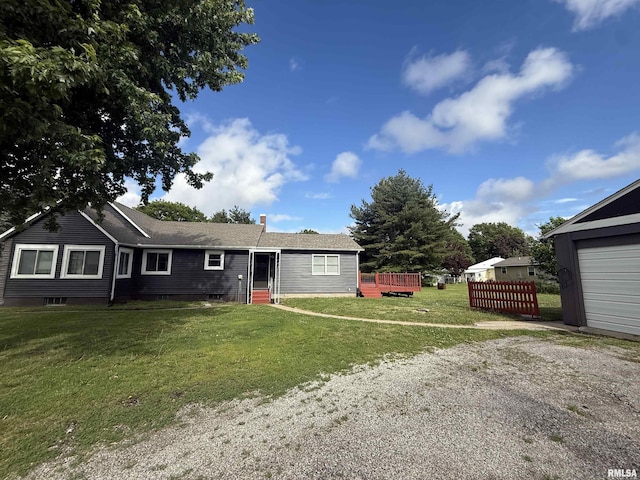 130 E Maple St, Roseville, IL 61473 - ranch-style home featuring driveway, a front lawn, and a wooden deck