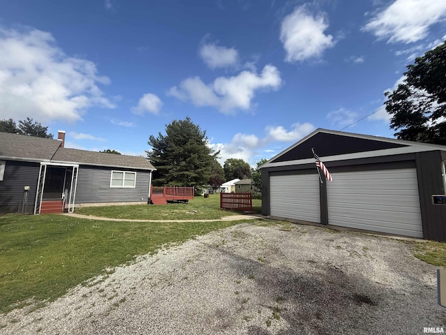 130 E Maple St, Roseville, IL 61473 - view of home's exterior featuring an outdoor structure, a lawn, and a wooden deck
