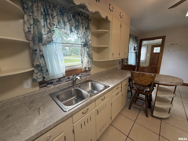 130 E Maple St, Roseville, IL 61473 - kitchen featuring open shelves, a sink, light tile patterned floors, light countertops, and ceiling fan